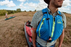 Paddling on the Mulde bringing one kayak after another to the river